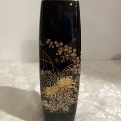 vintage Japanese vase with gold trim and a hand-painted floral design.