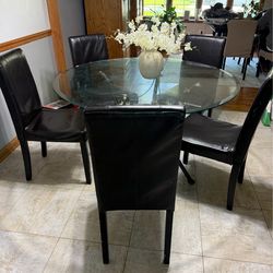 Beautiful round glass dining table with 5 chairs