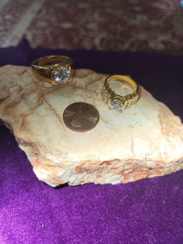 His/Hers Faux Diamond Rings. Ladies Is Approximately Size 6. Men's Approximately Size 9. Great Condition. Goldtone.