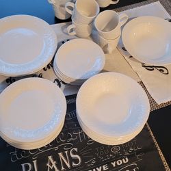 Set of white dishes, plates, cups