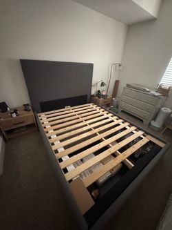 Queen upholstered bed frame with storage