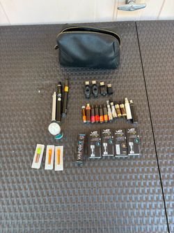 V2 Pro Series 3 vaping devices and accessories, including multiple batteries and cartridges.The set features several cartridges intended for e-liquid,