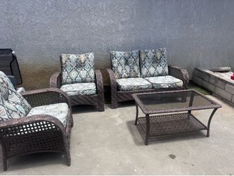 Brown Wicker Patio Furniture and Glass Top Coffee Table