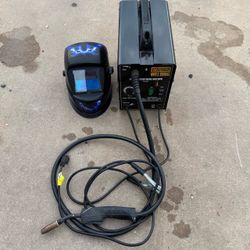 Chicago Electric Flux Core 125 AMP  and welding helmet features an auto-darkening lens