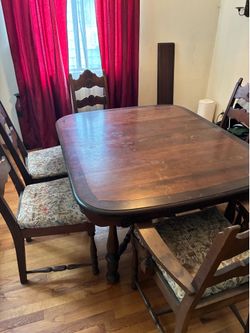 Walnut dining table and six chairs