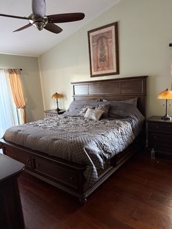 American Signature king size bed and mattress, chest of drawers with mirror, and two night stands with lamps