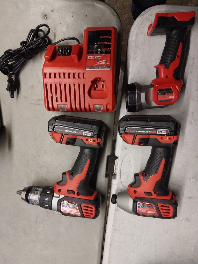 MILWAUKEE IMPACT DRIVER AND DRILL 18V LITHIUM INCLUDING FLASH LIGHT WITH BATTERYS AND CHARGER