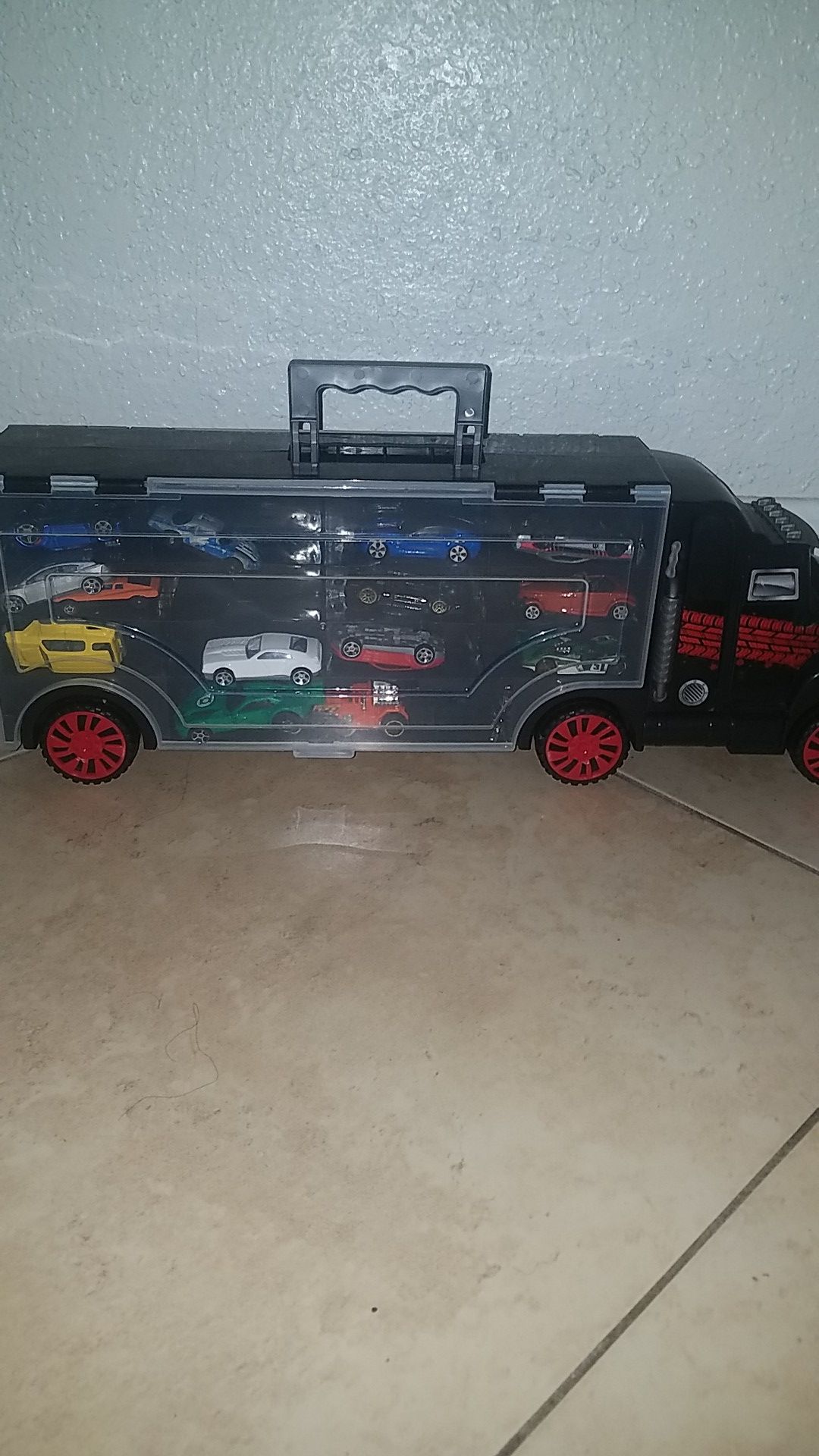 Toy truck with toy cars inside