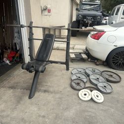 Bench press with 7ft bar plus 300lbs of Olympic weights