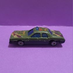 Vintage 1970's Army Green Camouflage Dodge Monaco 3" Plastic Toy Police Car.