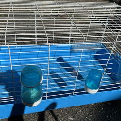 Small Pet Cage With Water Spouts And Feeder. 