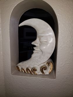 Moon face sculpture