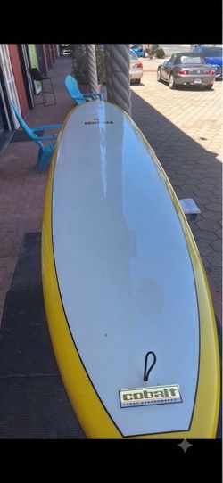 Cobalt 10 ft yellow and white fiberglass performance log surfboard