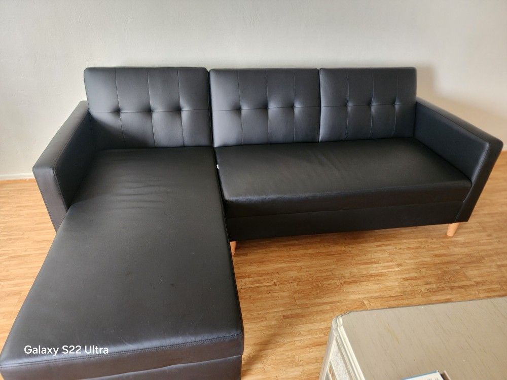 DHP Hartford Black Faux Leather Storage Sectional Futon