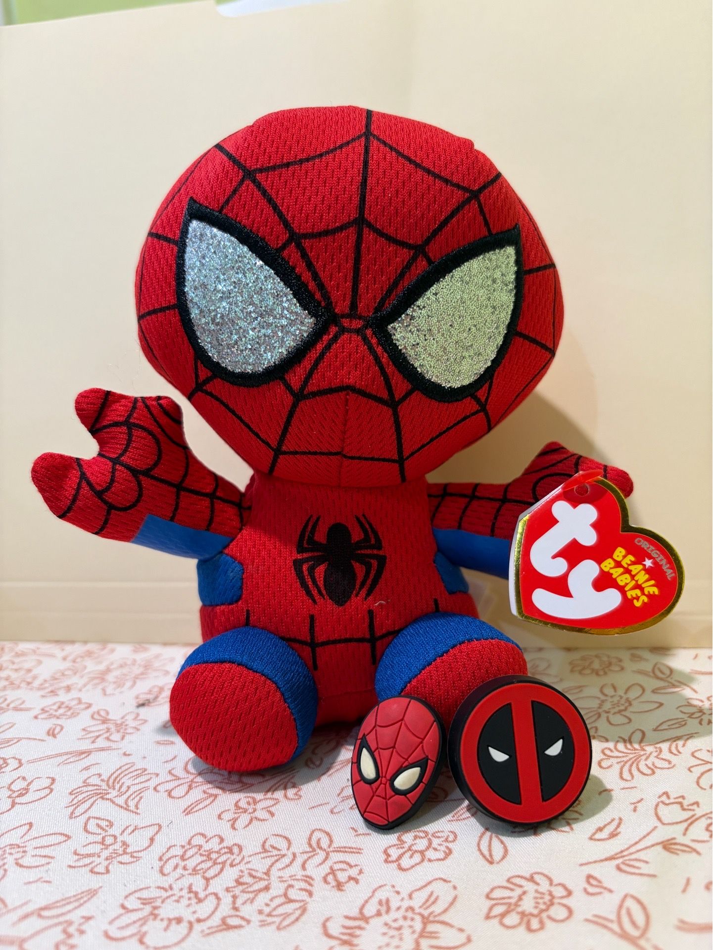 Spiderman Beanie Baby, Deadpool Funk Pop T-shirt, Croc Charms