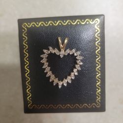 10 K Gold Diamond Heart Pendant.  Weight Is 2 Grams 