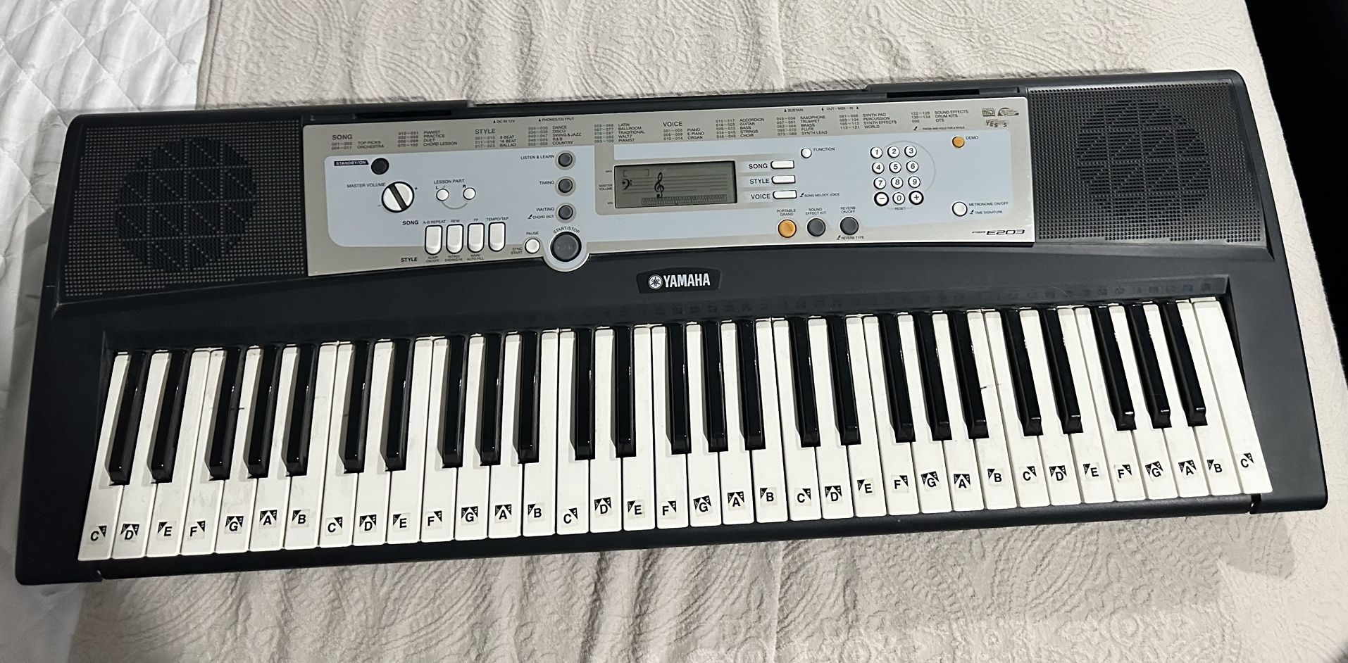 The Yamaha PSR-E203 is a portable 61-key electronic keyboard 