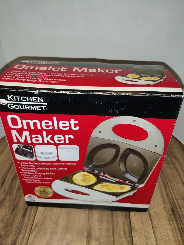 KITCHEN GOURMET ELECTRIC OMELET MAKER WHITE SW-086. Packaging has some wear from age and storage. Sold as is.