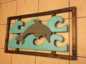 Solid wood hand made dolphin in wood frame