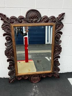 Carved wood mirror