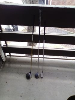 Golf clubs two drivers one putter