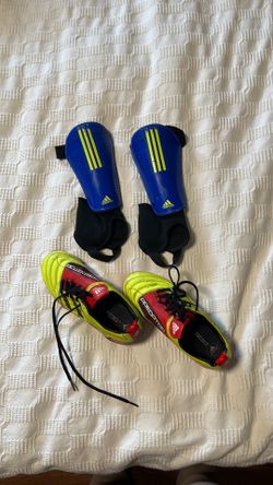 Kids Adidas cleats and shin protectors