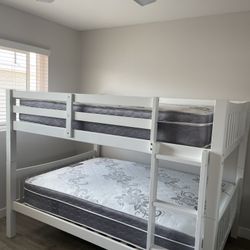 Full over Full bunk bed. Dark walnut,grey & white-$499. Full mattresses -$125.00 each. Assembly not included. Taxes included. Free delivery.  Se habla