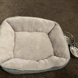 dog bed and two bowls