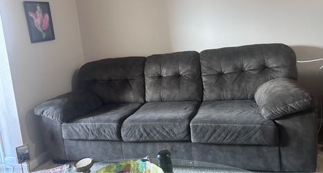 Comfortable sofa in very good condition and like new for 6 or more people near and Ashley