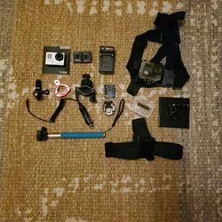 GoPro With Extra Batteries And Accessories