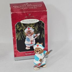 SPOONFUL OF LOVE 1998 Hallmark NURSE Christmas Tree Ornament Bunny doctor spoon 

Excellent Pre-owned condition, no flaws
Box has some wear due to sto