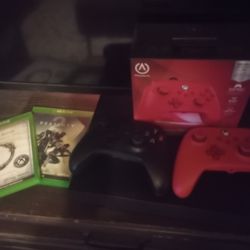 Xbox One X, 2 Controllers, And 2 Games