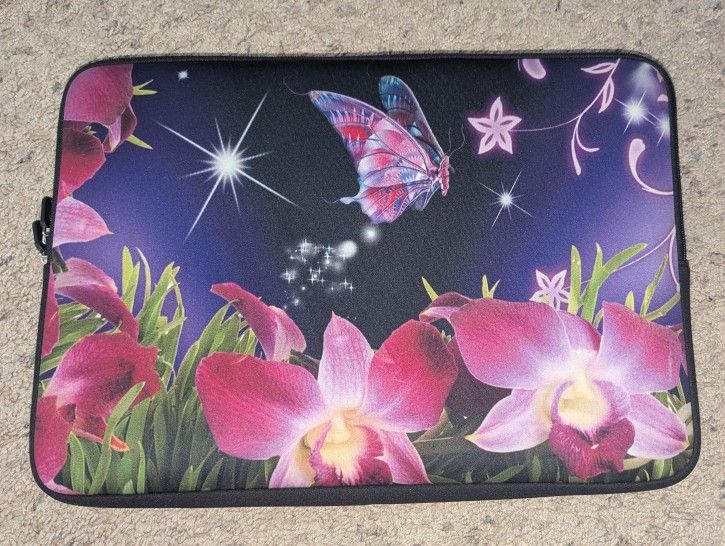 Neoprene butterfly and flower laptop case with hidden handle.