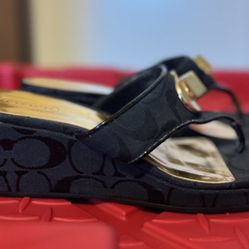 Coach signature wedge thong sandals featuring black logo fabric and gold-tone hardware. Size 7