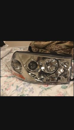 2004 Saturn L300 Right Passenger Headlight (NEW)