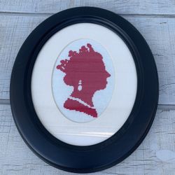 Cross-Stitch Silhouette Portrait, Handcrafted Red on Cream, Oval black Frame 13”