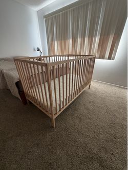 IKEA SNIGLAR crib, beech 27 1/2 x 52”  comes with Mattress