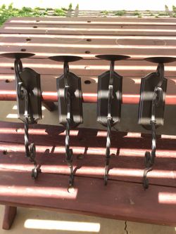 Four metal candleholders