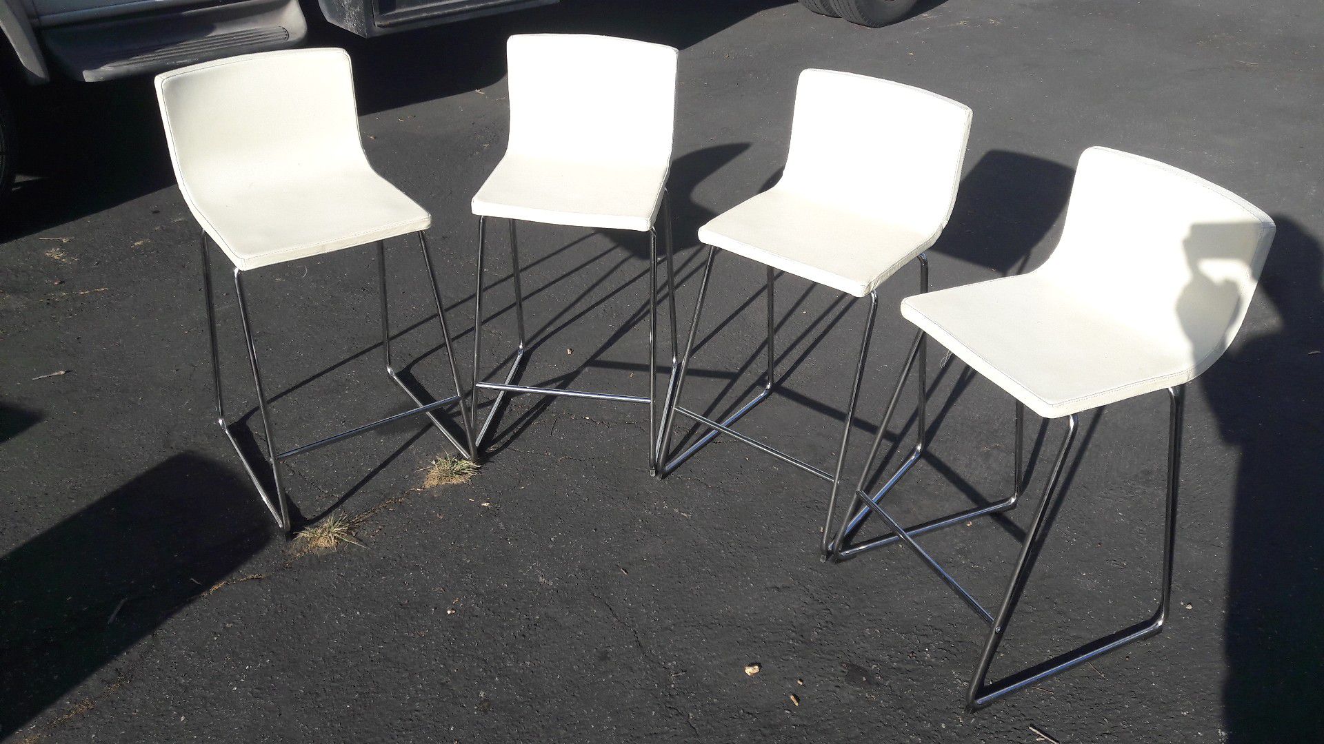 A set of bar chairs. H seats=26". Genuine soft beige leather