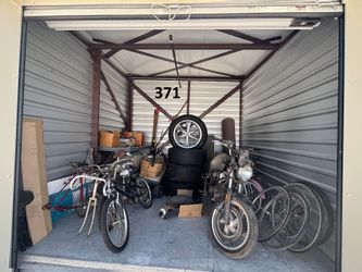 Auction Unit  371  6/13 - Auto Parts, Boxes, Camping Gear,  Exercise Equipment, Totes, Tubs, Pacer Rims, Motorcycle, Garage Items