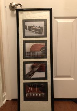 Picture of pieces of a guitar. Never even been hung