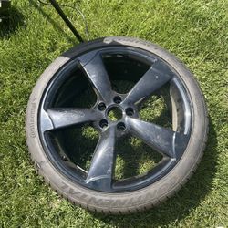 One Audi Rim With Tire Open