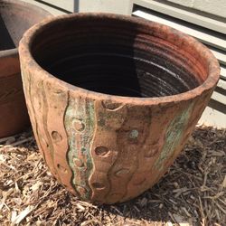 Clay Pot And A  Metal Art Work For The Yard