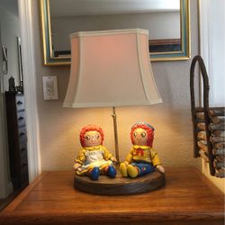 Raggedy Ann and Andyand glazed in painted