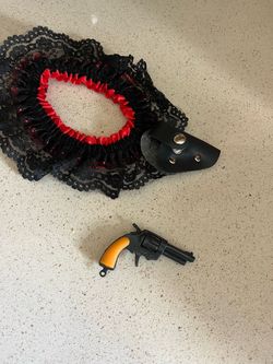 dress up garter with miniature play pistol that works