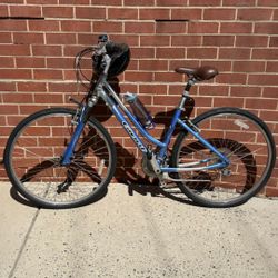 Adult Giant Cypress hybrid bike. “17”through frame. Suspension. With helmet included
