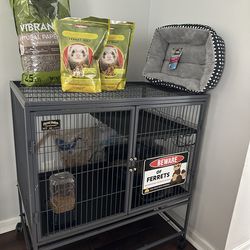 Ferrets cage with food and accessories