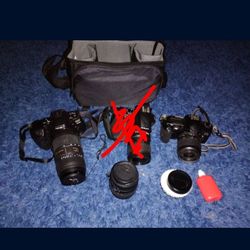 3 digital cameras with lens and case
