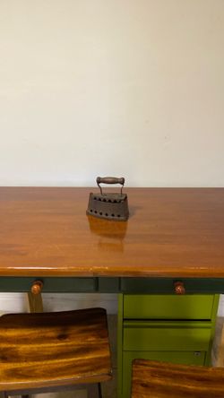 antique coal iron, likely dating from the late 1800s to early 1900s, a cast-iron body with a wooden handle