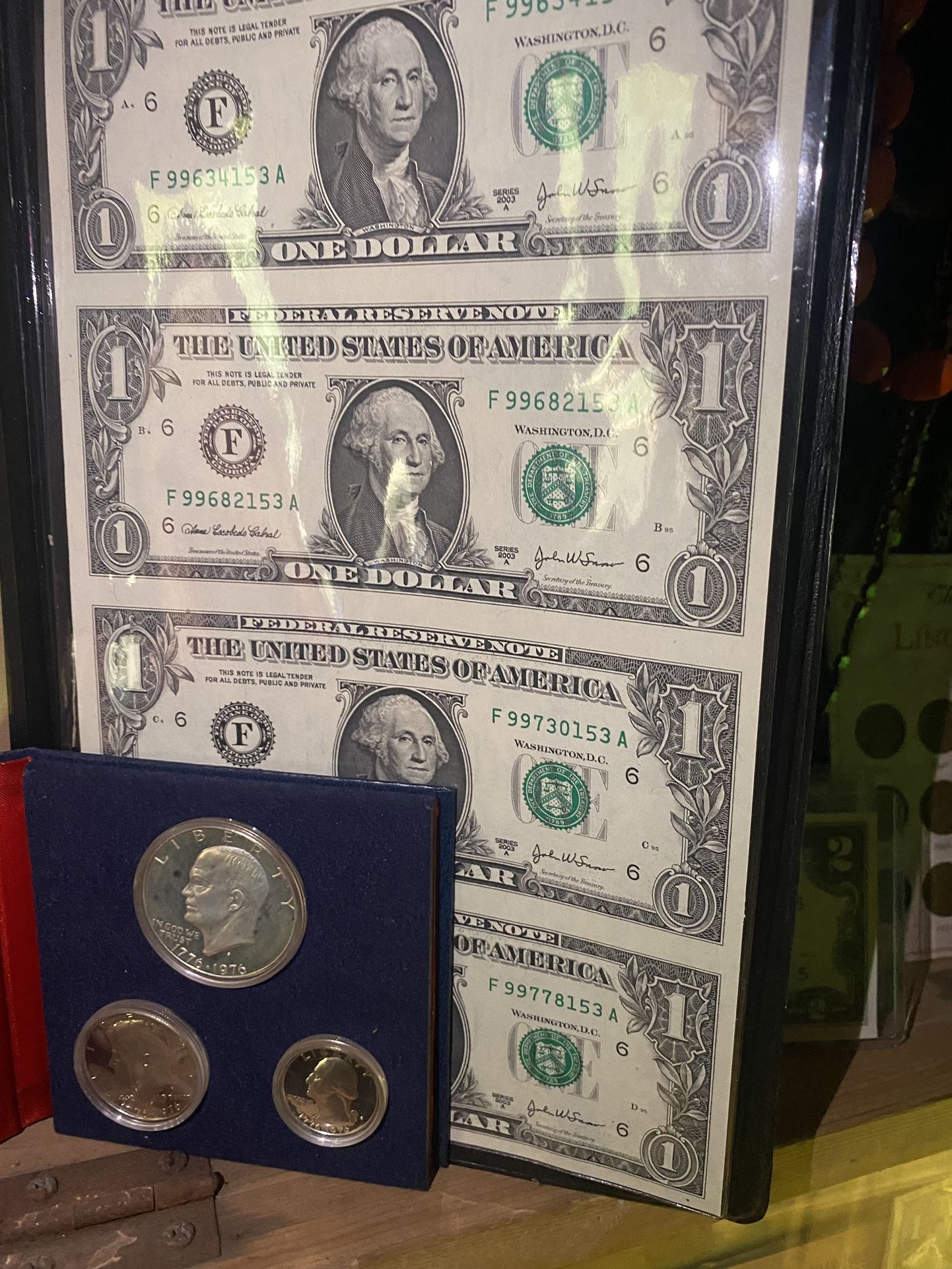 A one proof set silver with 2003/4 dollar bills uncut